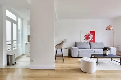 Coin salon dans l'établissement Magnifique appartement proche Champs-Elysees