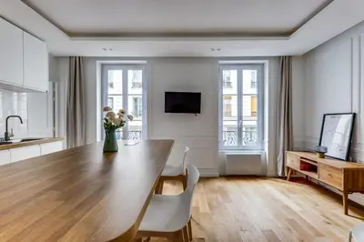 Télévision ou salle de divertissement dans l'établissement Bel appartement au coeur de Paris