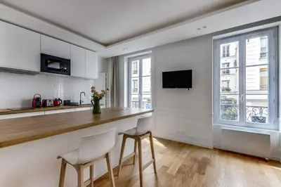 Cuisine ou kitchenette dans l'établissement Bel appartement au coeur de Paris