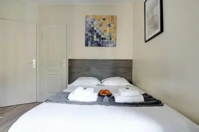 Un ou plusieurs lits dans un hébergement de l'établissement Chic Studio - 2P - Porte Saint-Martin