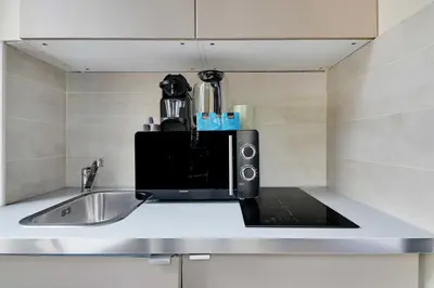 Cuisine ou kitchenette dans l'établissement Chic Studio - 2P - Porte Saint-Martin