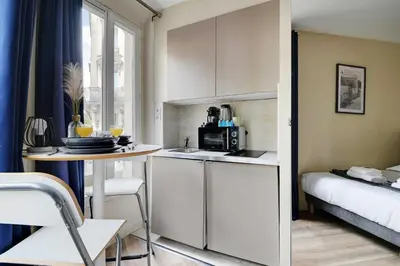 Un ou plusieurs lits dans un hébergement de l'établissement Chic Studio - 2P - Porte Saint-Martin