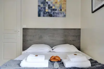 Un ou plusieurs lits dans un hébergement de l'établissement Chic Studio - 2P - Porte Saint-Martin