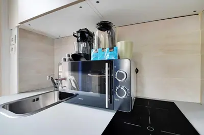 Cuisine ou kitchenette dans l'établissement Chic Studio - 2P - Porte Saint-Martin