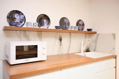 Cuisine ou kitchenette dans l'établissement Cosy Appartement Studio Moderne Mezzanine - 4P