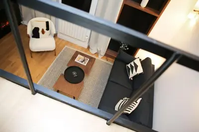 Coin salon dans l'établissement Cosy Appartement Studio Moderne Mezzanine - 4P