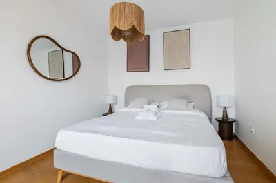 Un ou plusieurs lits dans un hébergement de l'établissement Appartement lumineux avec terrasse Courbevoie - 4P