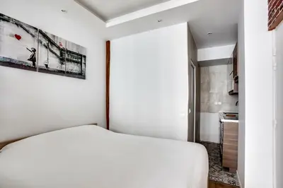 Un ou plusieurs lits dans un hébergement de l'établissement Appartement Cosy Rue de la Chaussee d'Antin - 4P