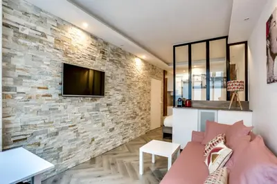 Télévision ou salle de divertissement dans l'établissement Appartement Cosy Rue de la Chaussee d'Antin - 4P