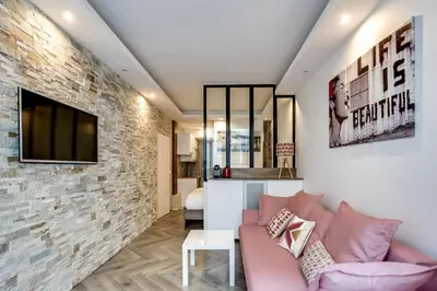 Coin salon dans l'établissement Appartement Cosy Rue de la Chaussee d'Antin - 4P