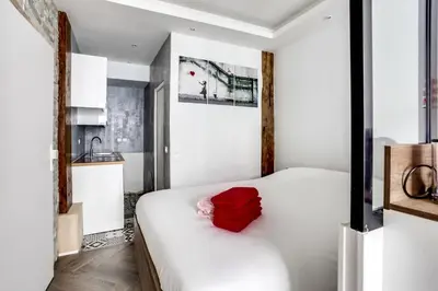 Un ou plusieurs lits dans un hébergement de l'établissement Appartement Cosy Rue de la Chaussee d'Antin - 4P