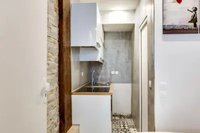 Cuisine ou kitchenette dans l'établissement Appartement Cosy Rue de la Chaussee d'Antin - 4P