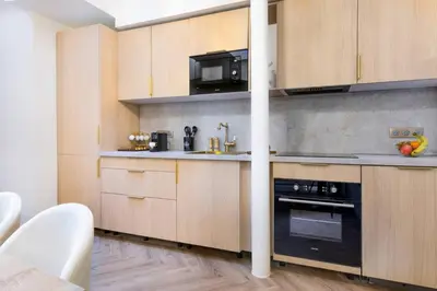 Cuisine ou kitchenette dans l'établissement Sublime 3 chambres a Montmartre avec Clim et Jacuzzi