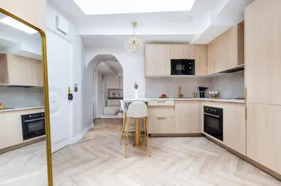 Cuisine ou kitchenette dans l'établissement Magnifique 3 chambres 3 SDE avec Clim et Jacuzzi