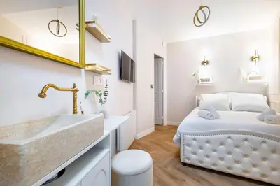 Un ou plusieurs lits dans un hébergement de l'établissement Magnifique 3 chambres 3 SDE avec Clim et Jacuzzi
