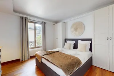 Un ou plusieurs lits dans un hébergement de l'établissement Avenue Montaigne - Prime Location