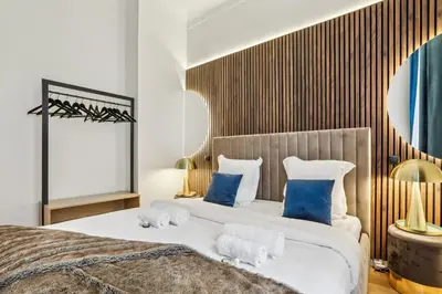 Un ou plusieurs lits dans un hébergement de l'établissement Prime Location - Orsay - Chic Apartment