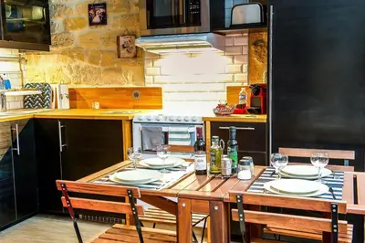 Cuisine ou kitchenette dans l'établissement Cosy Flat Paris between Opéra & Montmartre