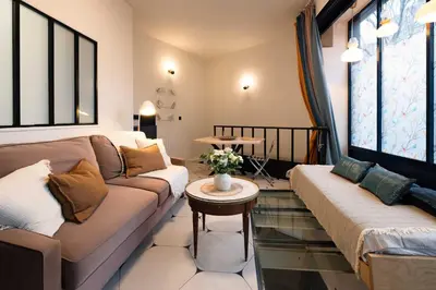 Coin salon dans l'établissement Souplex Design & Spacieux 7 pers Montmartre