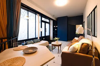 Un ou plusieurs lits dans un hébergement de l'établissement Souplex Design & Spacieux 7 pers Montmartre
