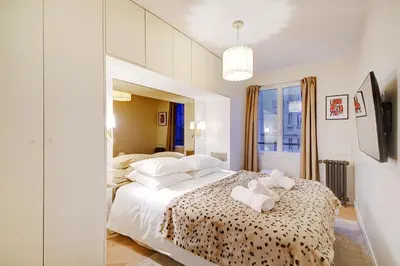 Un ou plusieurs lits dans un hébergement de l'établissement Chic Loft