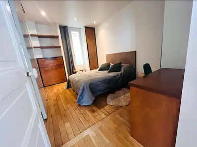 Un ou plusieurs lits dans un hébergement de l'établissement Paris Arc Design