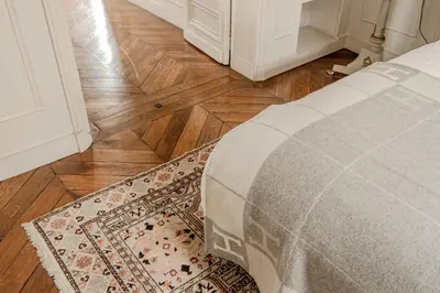 Un ou plusieurs lits dans un hébergement de l'établissement AC 3bds Apt with arc de triomphe view & terrace