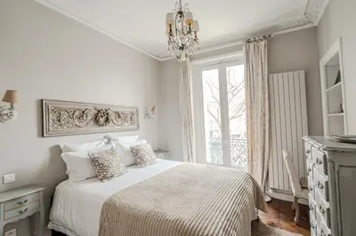 Un ou plusieurs lits dans un hébergement de l'établissement AC 3bds Apt with arc de triomphe view & terrace