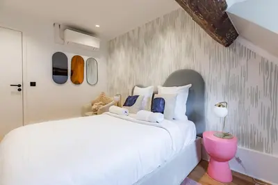 Un ou plusieurs lits dans un hébergement de l'établissement Bright AC Room Apartment in Marais Bastille