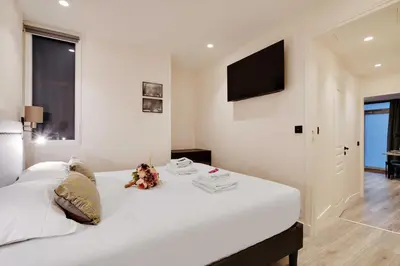 Un ou plusieurs lits dans un hébergement de l'établissement Modern apartment - 2BR 6P - Enfants-Rouges