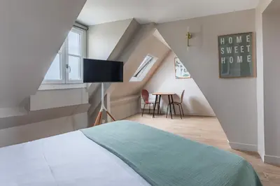 Un ou plusieurs lits dans un hébergement de l'établissement Charming Parisian studio in Bastille Marais