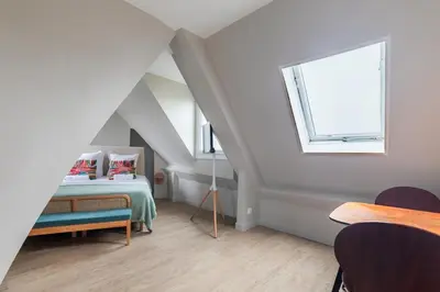 Un ou plusieurs lits dans un hébergement de l'établissement Charming Parisian studio in Bastille Marais