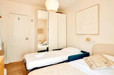 Un ou plusieurs lits dans un hébergement de l'établissement Modern flat in Levallois
