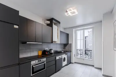 Cuisine ou kitchenette dans l'établissement Elegant 3 bedrooms in the heart of Paris Bastille