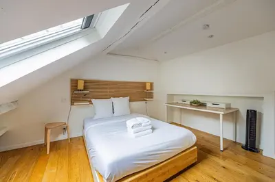 Un ou plusieurs lits dans un hébergement de l'établissement Au coeur de Paris 1bedroom Bastille Paris 11