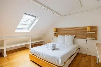 Un ou plusieurs lits dans un hébergement de l'établissement Au coeur de Paris 1bedroom Bastille Paris 11