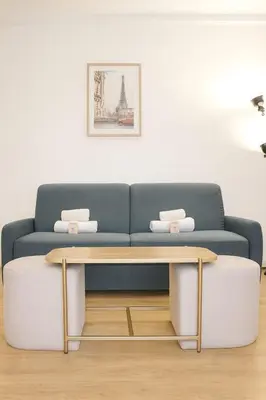 Coin salon dans l'établissement Cocon cosy in the heart of Paris - few steps from Moulin Rouge