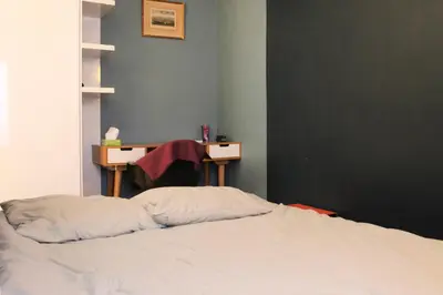 Un ou plusieurs lits dans un hébergement de l'établissement Bright studio in the heart of Paris well located