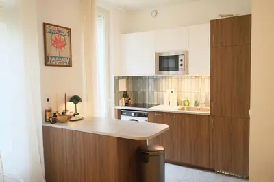 Cuisine ou kitchenette dans l'établissement Elegant two-room apartment with garden, 10 min from La Défense