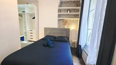 Un ou plusieurs lits dans un hébergement de l'établissement APPARTEMENT TOUT NEUF QUARTIER TOUR EIFFEL, INVALIDES et TROCADERO