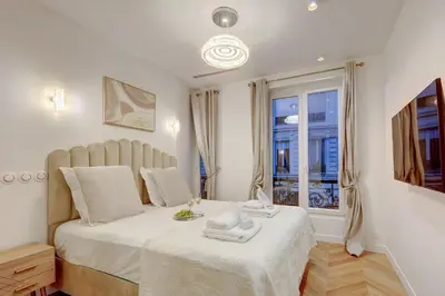 Un ou plusieurs lits dans un hébergement de l'établissement TBS 204 - Prestigious suite near Champs-Élysées