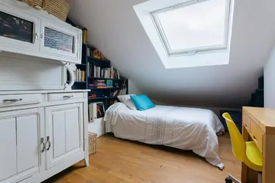 Un ou plusieurs lits dans un hébergement de l'établissement Le Rooftop Aux Puces - Terrasse rooftop