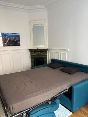 Un ou plusieurs lits dans un hébergement de l'établissement Cozy studio in Paris