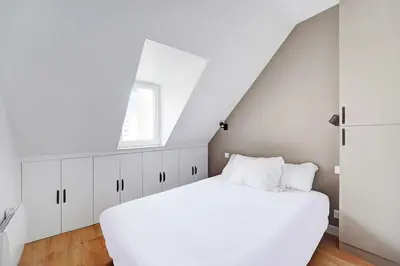 Un ou plusieurs lits dans un hébergement de l'établissement Comfortable and modern 2P studio - 16th Paris
