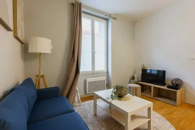 Coin salon dans l'établissement Charming studio 2P – Near the Eiffel Tower