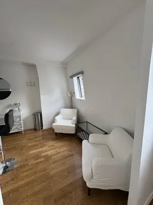 Coin salon dans l'établissement Paris 19 Cozy Stay