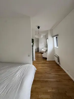 Un ou plusieurs lits dans un hébergement de l'établissement Paris 19 Cozy Stay
