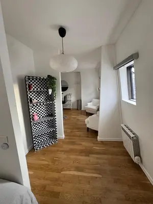 Coin salon dans l'établissement Paris 19 Cozy Stay