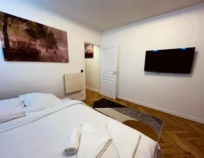 Un ou plusieurs lits dans un hébergement de l'établissement Magnifique Appartement - 3 BR-Arc de Triomphe