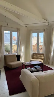 Coin salon dans l'établissement Duplex, grand balcon et sauna